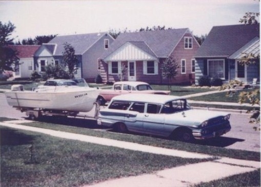 Just a car with boat around upper block of 28th and Colorado Ave S circa 1960