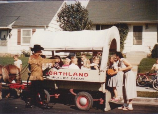Northland Dairy would rent out ponies and a wagon with rustic driver for kids birthdays.  Late 50s.  Picture taken by Cornelius Fideldy.